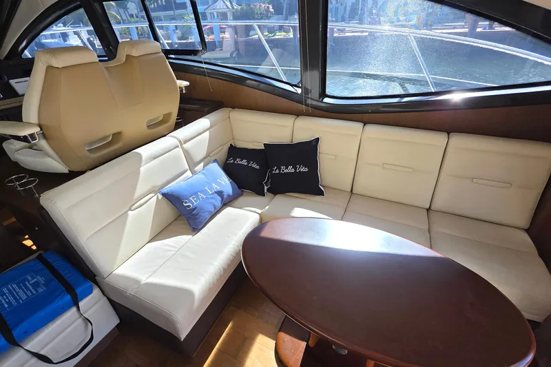  Yacht Photos Pics Luxurious interior of 2016 Sea Ray Sundancer 400 yacht with plush seating and cushions.