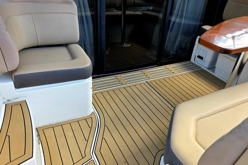  Yacht Photos Pics Interior seating area of 2016 Sea Ray Sundancer 400 yacht with wood flooring.