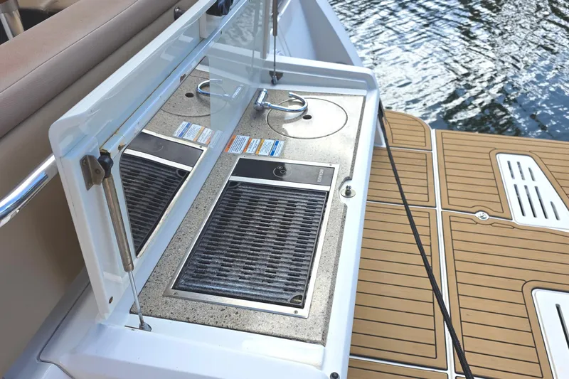  Yacht Photos Pics Outdoor kitchen area on 2016 Sea Ray Sundancer 400 yacht, featuring a grill and sink.