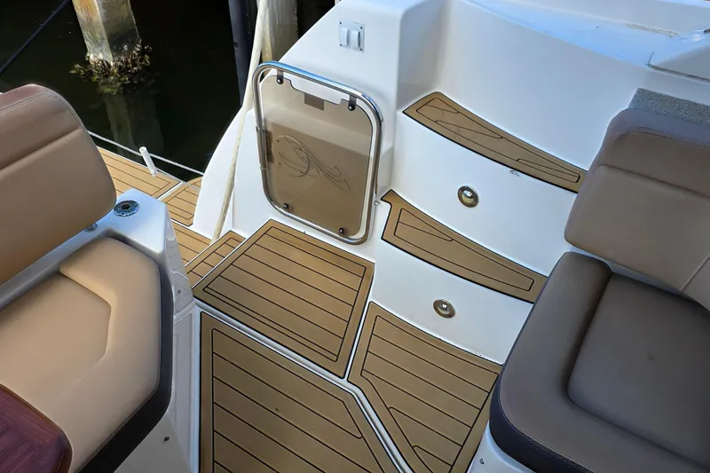  Yacht Photos Pics 2016 Sea Ray Sundancer 400 boat deck with tan seating and wood-style flooring.