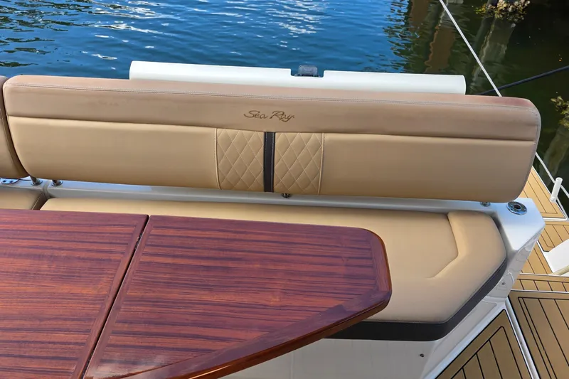  Yacht Photos Pics 2016 Sea Ray Sundancer 400 boat interior with tan seating and wooden table.