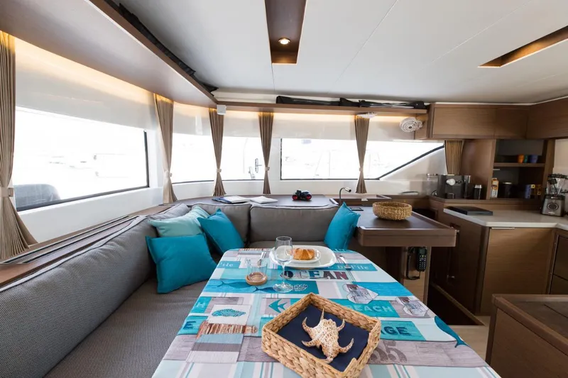 Twin Joy Yacht Photos Pics Interior of 2019 Lagoon LAGOON 50 yacht with modern kitchen and cozy seating area.
