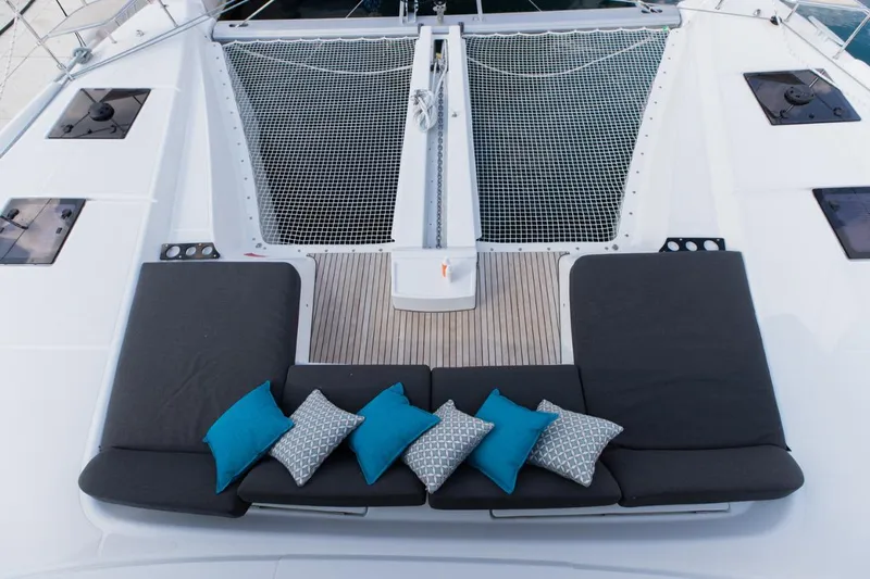Twin Joy Yacht Photos Pics Luxurious 2019 Lagoon 50 yacht deck with comfortable seating and decorative cushions.