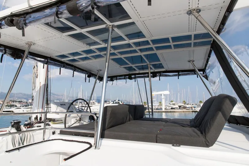 Twin Joy Yacht Photos Pics 2019 Lagoon 50 yacht with spacious deck and comfortable seating in marina.