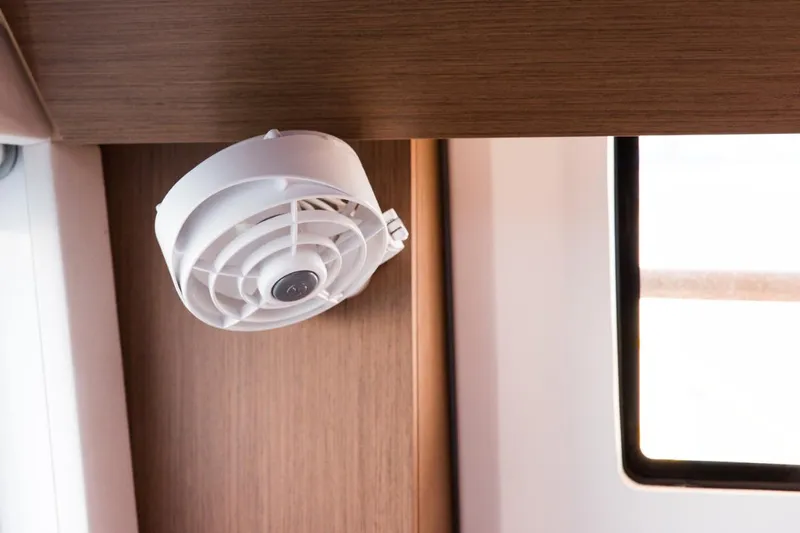 Twin Joy Yacht Photos Pics Ceiling fan inside 2019 Lagoon LAGOON 50 yacht cabin, near window.