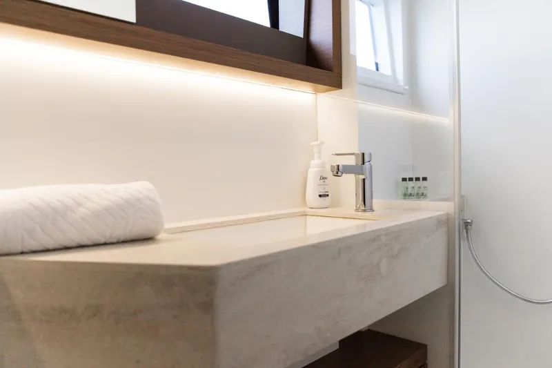 Twin Joy Yacht Photos Pics Modern bathroom sink in 2019 Lagoon 50 yacht, featuring sleek design and elegant fixtures.