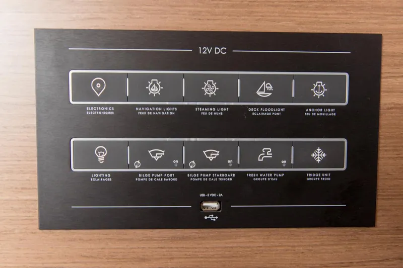 Twin Joy Yacht Photos Pics Control panel of a 2019 Lagoon LAGOON 50 yacht, featuring various electronic and lighting switches.