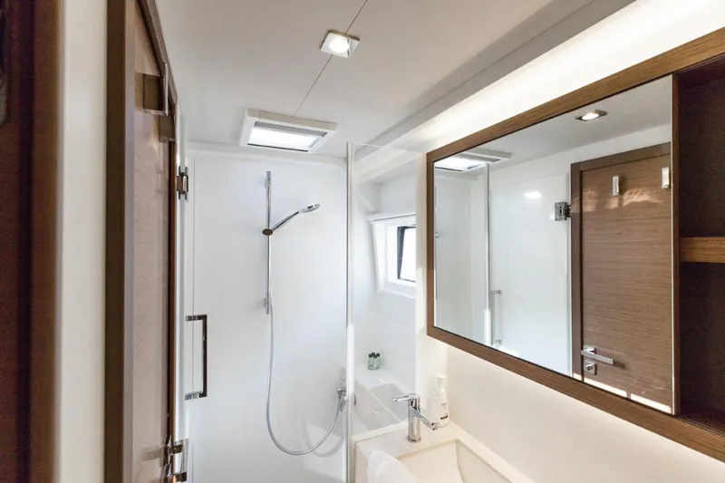 Twin Joy Yacht Photos Pics Modern bathroom interior on 2019 Lagoon 50 yacht, featuring sleek design and fixtures.