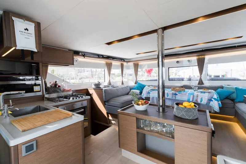 Twin Joy Yacht Photos Pics Luxurious interior of 2019 Lagoon 50 yacht with modern kitchen and dining area.