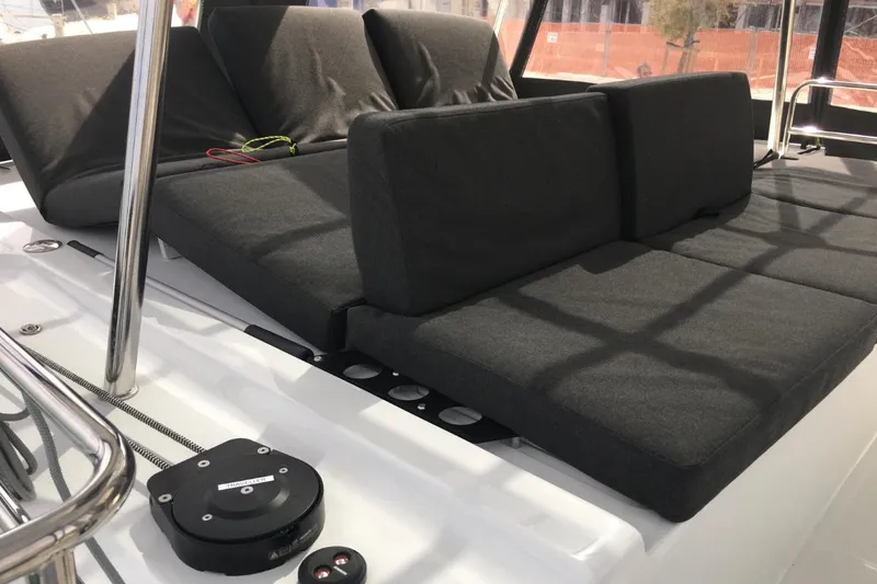 Twin Joy Yacht Photos Pics Luxurious seating area on 2019 Lagoon 50 catamaran with plush gray cushions.