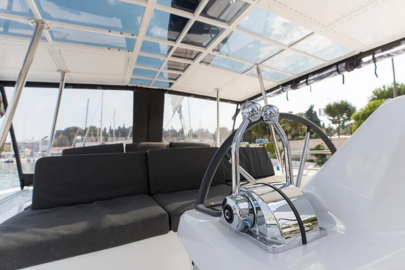 Twin Joy Yacht Photos Pics Luxurious 2019 Lagoon 50 yacht interior with modern helm and comfortable seating.