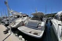 2020 Fairline Targa 48 Open yacht docked in a sunny marina.