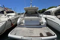 2020 Fairline Targa 48 Open yacht docked at marina, rear view.