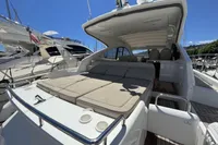 2020 Fairline Targa 48 Open yacht with spacious sunbed and sleek design in marina.