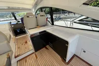 2020 Fairline Targa 48 Open yacht interior with sleek seating and wooden flooring.