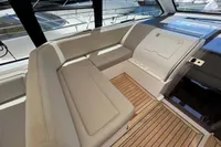2020 Fairline Targa 48 Open yacht interior with beige seating and wooden flooring.