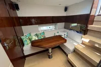 Luxurious interior of 2020 Fairline Targa 48 Open yacht with elegant seating and wooden table.