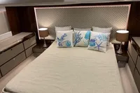 Luxurious bedroom interior of 2020 Fairline Targa 48 Open yacht with elegant decor.