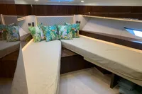 Luxurious cabin interior of 2020 Fairline Targa 48 Open yacht with tropical-themed pillows.