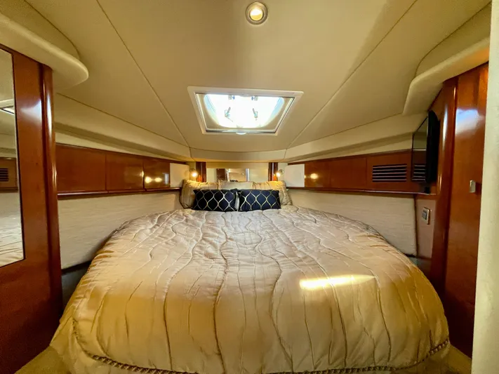 Deja Blue Yacht Photos Pics Luxurious cabin interior of 2005 Sea Ray 390 Sundancer yacht with plush bedding.