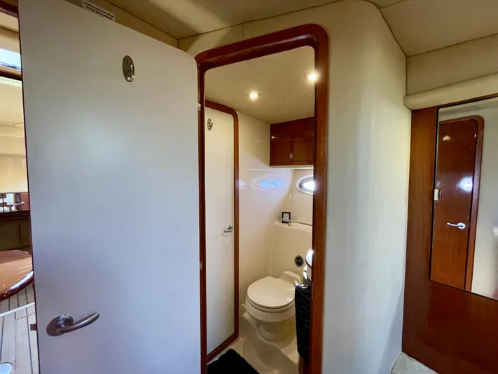 Deja Blue Yacht Photos Pics 2005 Sea Ray 390 Sundancer yacht bathroom interior with modern fixtures and wood accents.