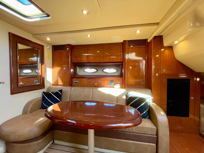 Deja Blue Yacht Photos Pics Luxurious interior of 2005 Sea Ray 390 Sundancer yacht with elegant wood finishes.