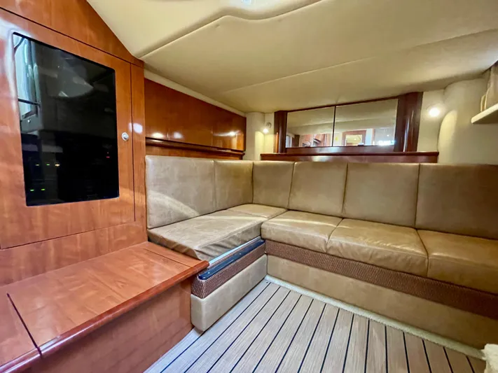 Deja Blue Yacht Photos Pics Interior of 2005 Sea Ray 390 Sundancer with beige seating and wooden accents.