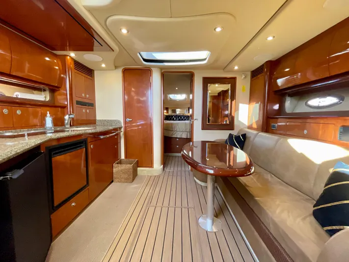 Deja Blue Yacht Photos Pics Interior of 2005 Sea Ray 390 Sundancer yacht with luxurious wood finish and modern amenities.