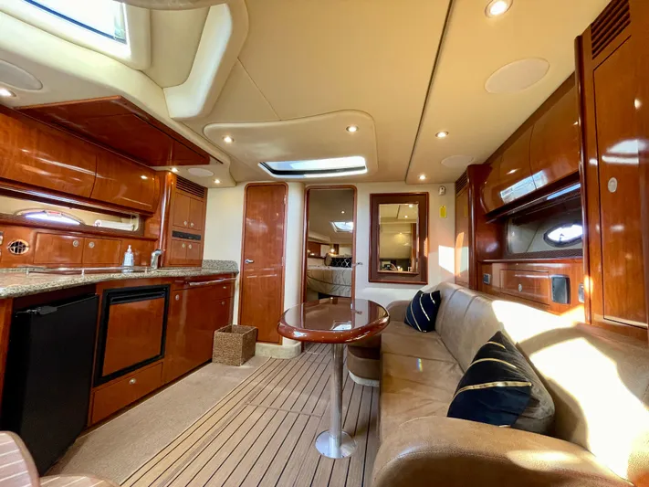 Deja Blue Yacht Photos Pics Luxurious interior of a 2005 Sea Ray 390 Sundancer yacht with elegant wood finishes.