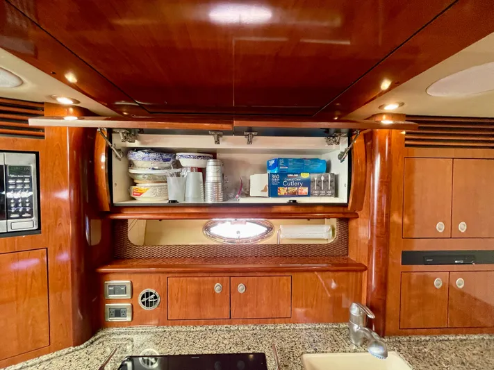 Deja Blue Yacht Photos Pics 2005 Sea Ray 390 Sundancer kitchen with wooden cabinets and granite countertop.