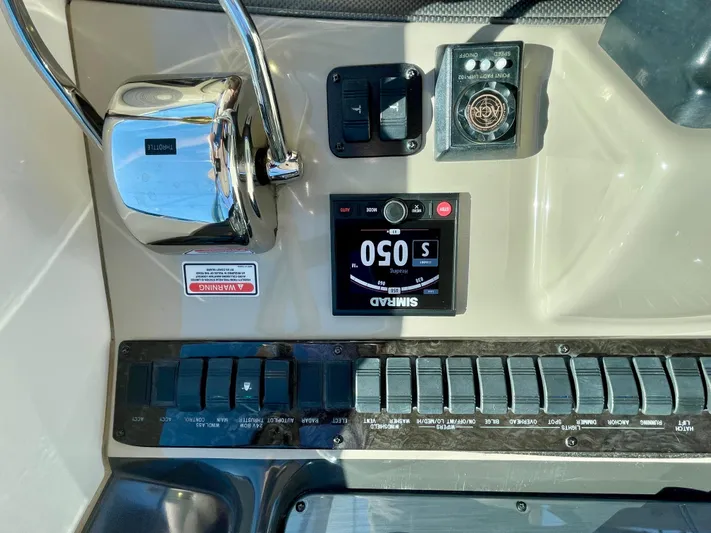 Deja Blue Yacht Photos Pics Control panel of a 2005 Sea Ray 390 Sundancer boat with various switches and gauges.