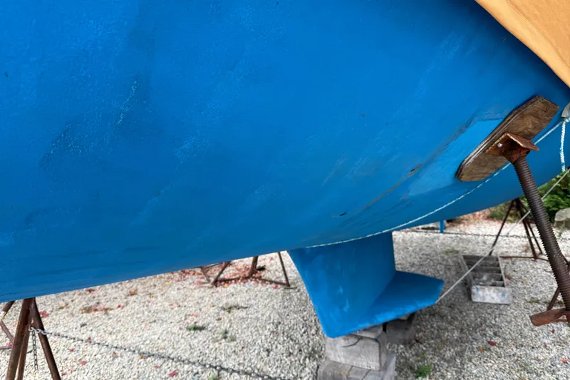 Finisterre Yacht Photos Pics Blue hull of a 2006 Catalina 36 MkII sailboat on stands.