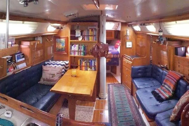 Finisterre Yacht Photos Pics Interior of 2006 Catalina 36 MkII sailboat with cozy seating and wooden furnishings.