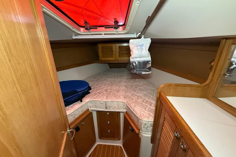 Finisterre Yacht Photos Pics Cozy cabin interior of 2006 Catalina 36 MkII sailboat with wooden finish.