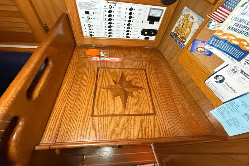 Finisterre Yacht Photos Pics Wooden navigation station on 2006 Catalina 36 MkII sailboat with star inlay design.