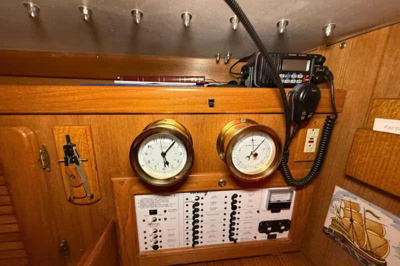 Finisterre Yacht Photos Pics Interior of 2006 Catalina 36 MkII sailboat with navigation instruments and radio equipment.