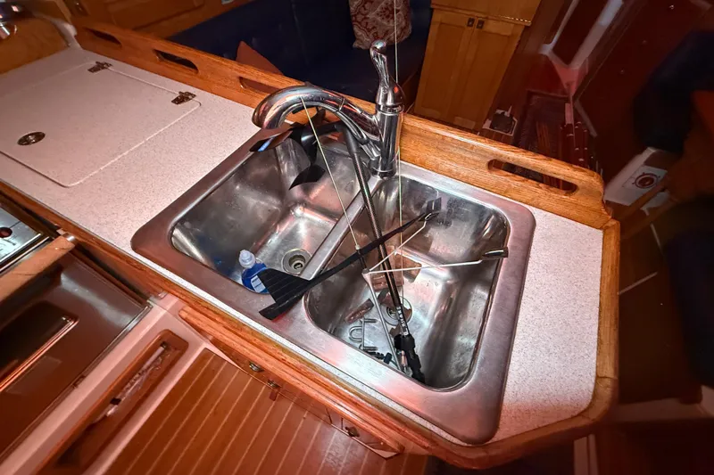 Finisterre Yacht Photos Pics Galley sink in 2006 Catalina 36 MkII sailboat with faucet and utensils.