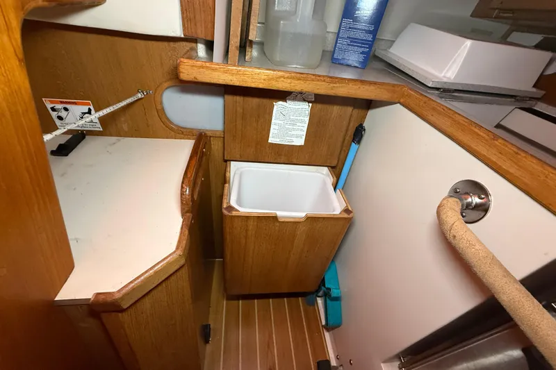 Finisterre Yacht Photos Pics Interior of 2006 Catalina 36 MkII sailboat with wooden cabinetry and storage area.