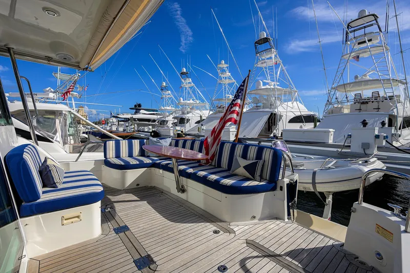 Vienna Yacht Photos Pics 2018 Sabre 48 Salon Express yacht with striped seating and American flag at marina.