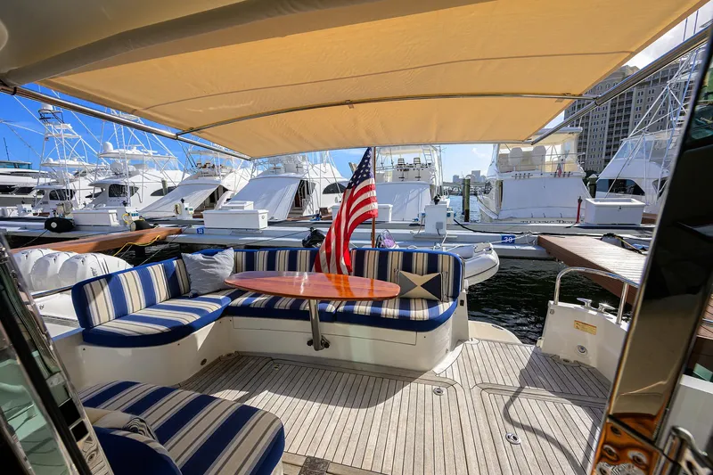 Vienna Yacht Photos Pics 2018 Sabre 48 Salon Express yacht with striped seating and American flag at marina.