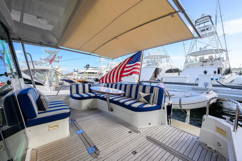 Vienna Yacht Photos Pics 2018 Sabre 48 Salon Express yacht with striped seating and American flag.