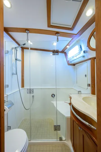 Vienna Yacht Photos Pics 2018 Sabre 48 Salon Express bathroom with glass shower, wooden accents, and modern fixtures.