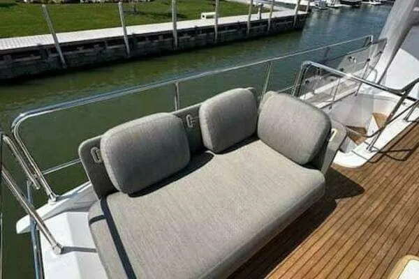  Yacht Photos Pics Luxurious seating area on 2020 Azimut 66 yacht deck, overlooking water.