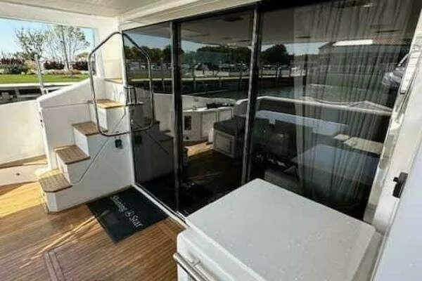  Yacht Photos Pics 2020 Azimut 66 yacht deck with stairs and glass doors, featuring modern design.