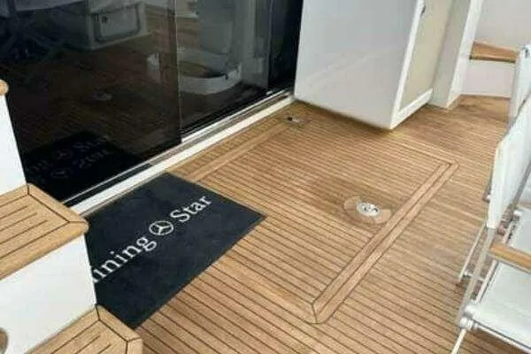  Yacht Photos Pics 2020 Azimut 66 yacht deck with wooden flooring and seating area.