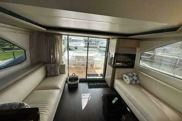  Yacht Photos Pics Luxurious interior of a 2020 Azimut 66 yacht with elegant seating and large windows.
