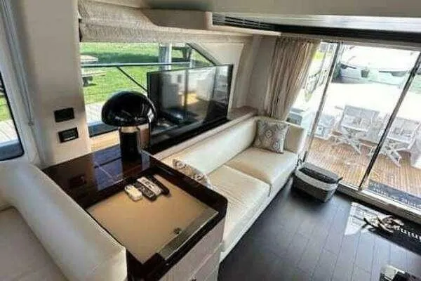  Yacht Photos Pics Luxurious interior of a 2020 Azimut 66 yacht with modern furnishings and large windows.