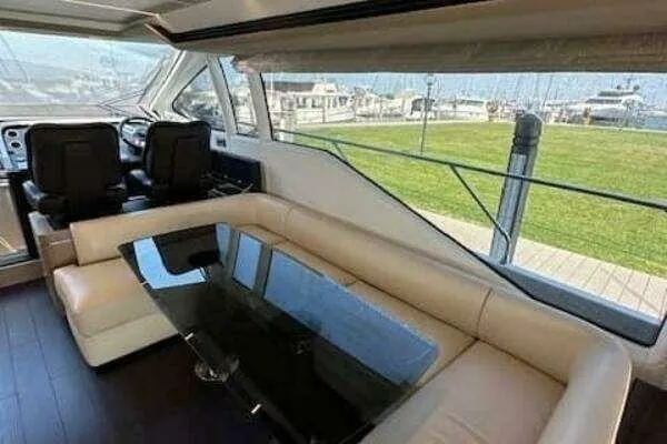  Yacht Photos Pics Luxurious interior of a 2020 Azimut 66 yacht with leather seating and glass table.