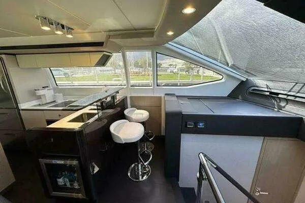  Yacht Photos Pics Luxurious interior of a 2020 Azimut 66 yacht with modern kitchen and seating area.
