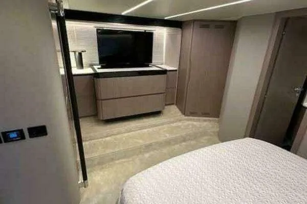  Yacht Photos Pics 2020 Azimut 66 yacht interior with modern bedroom and entertainment setup.